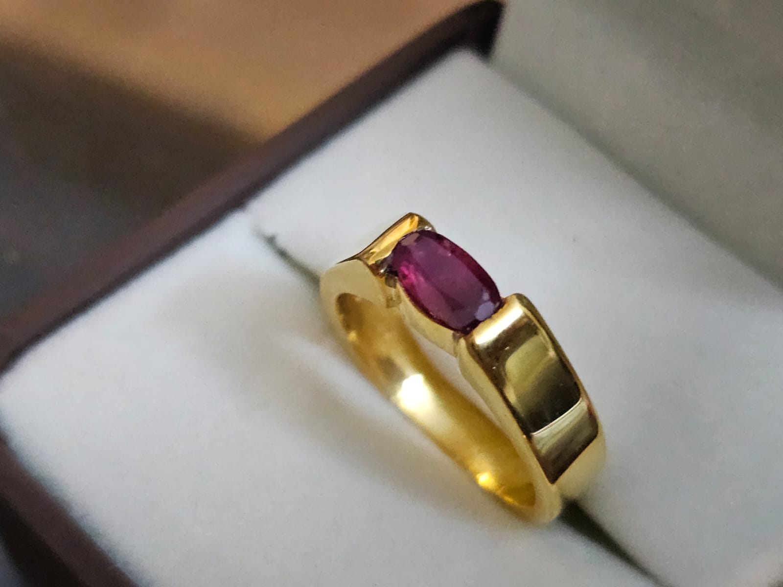 Natural ruby set in a yellow gold band