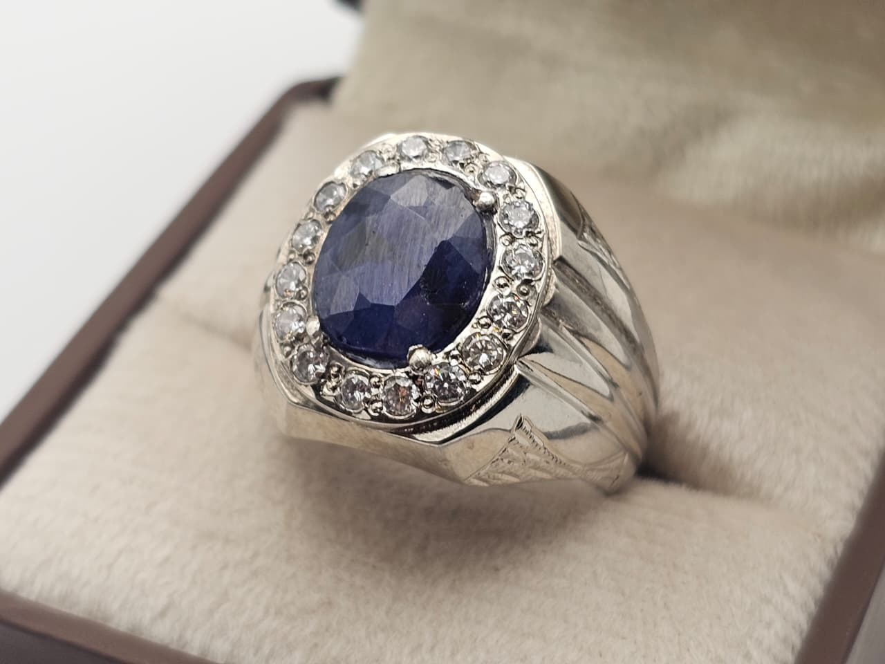 Blue sapphire in a silver halo ring